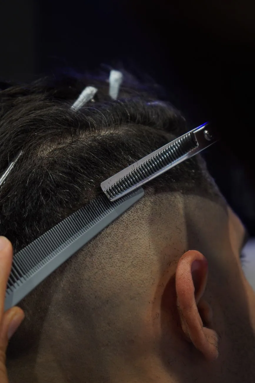 Dark close-up of clippers at work, used in example ad one