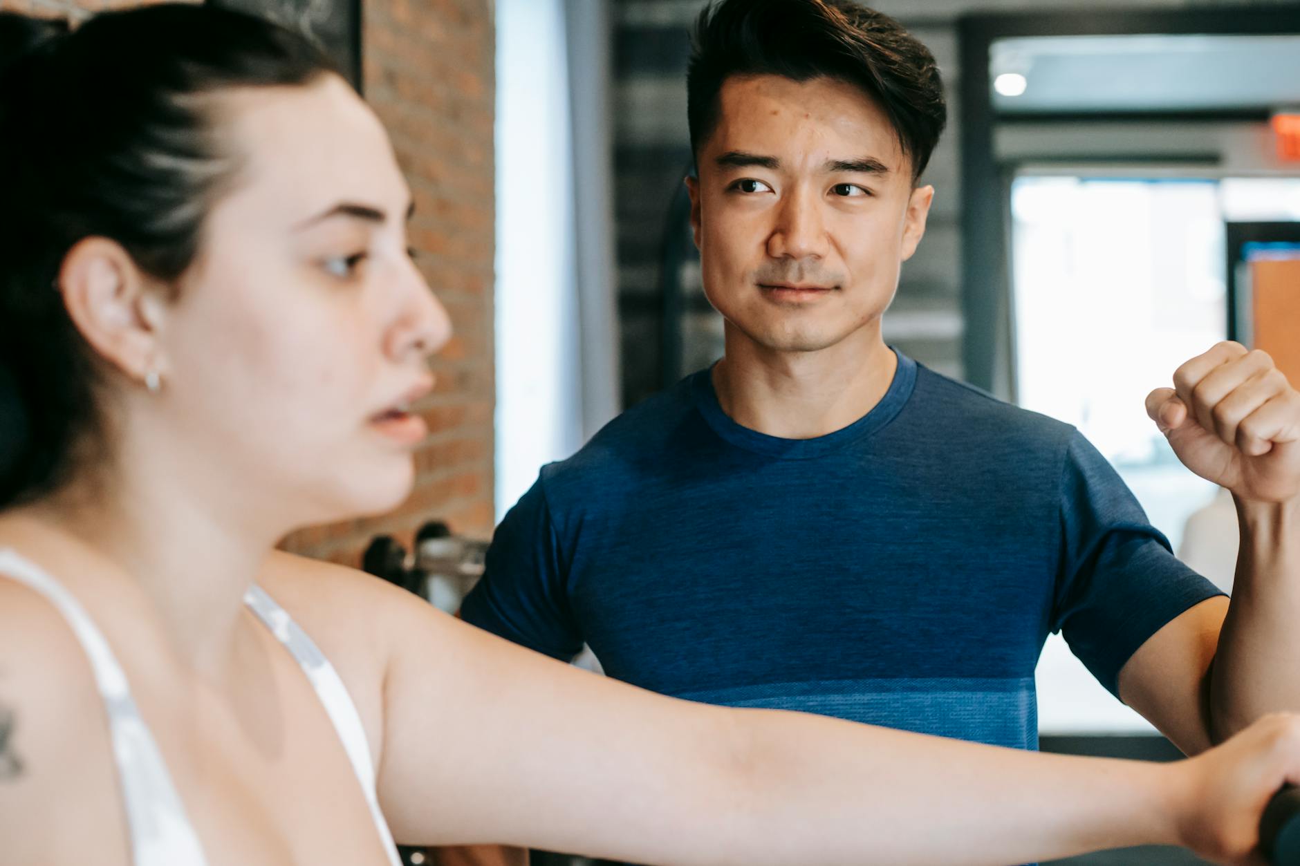 Female client receiving focused, individualized coaching guidance