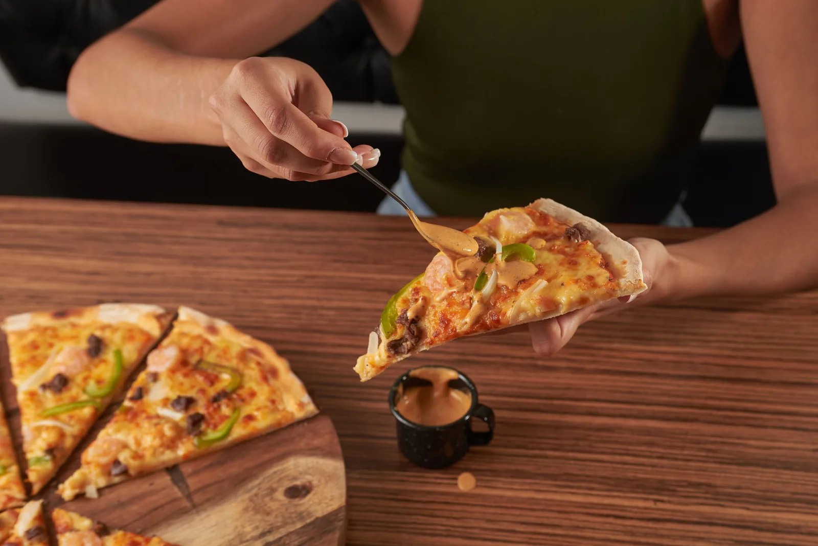 Motor City BBQ Chicken pizza with sauce drizzled on top