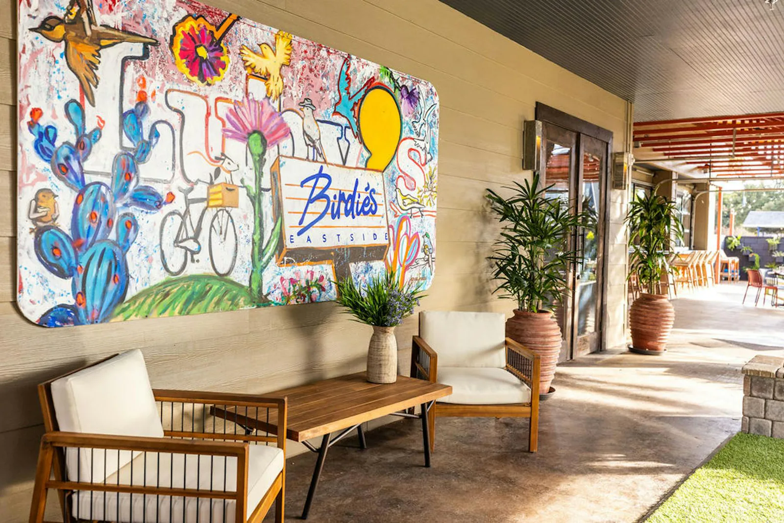 Inside Birdie's Eastside — warm lighting, full bar and dining room