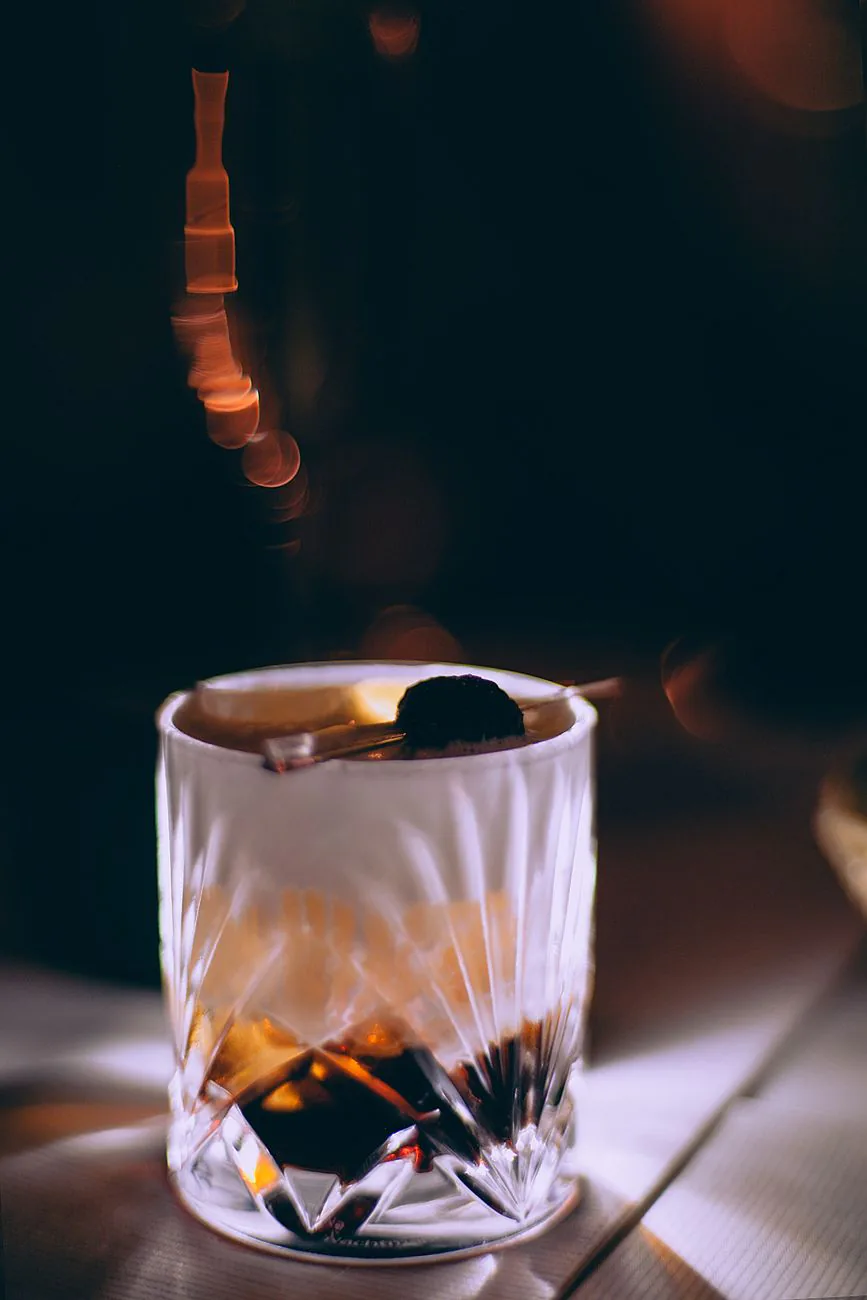 Cold cocktail in a dark bar