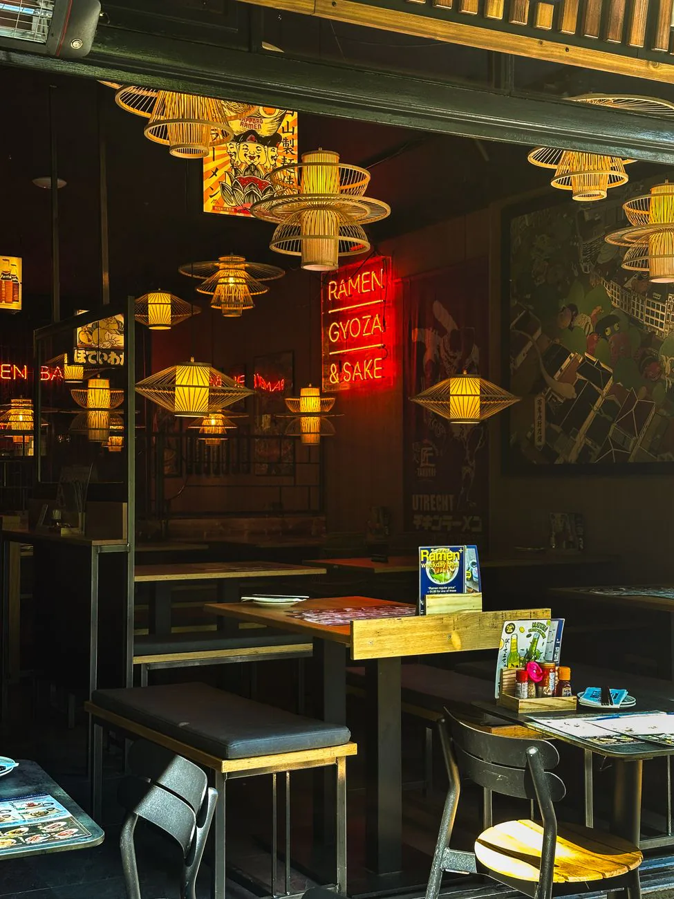 Restaurant interior with neon lights and wooden decor