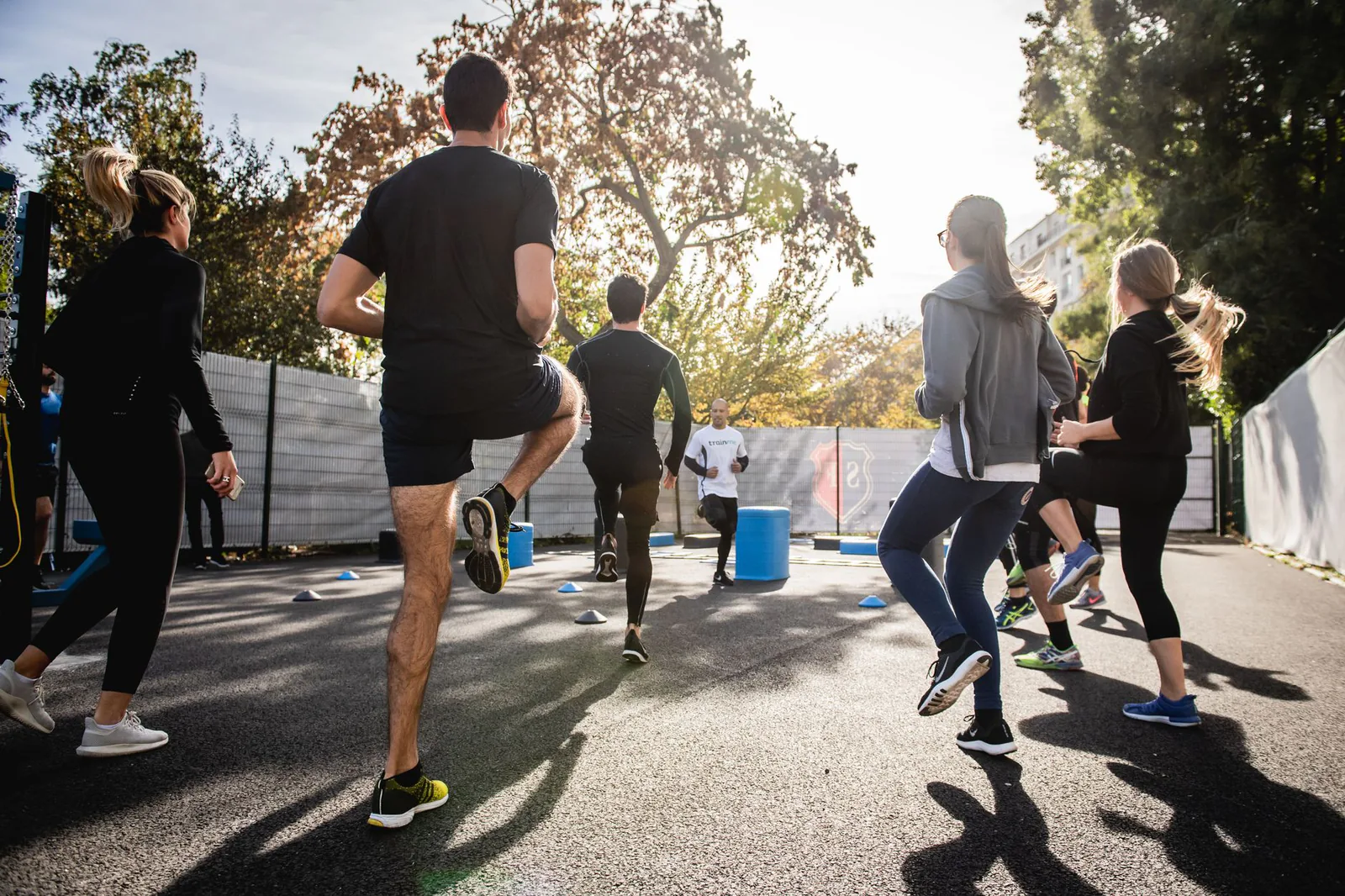 Group fitness session training together outdoors