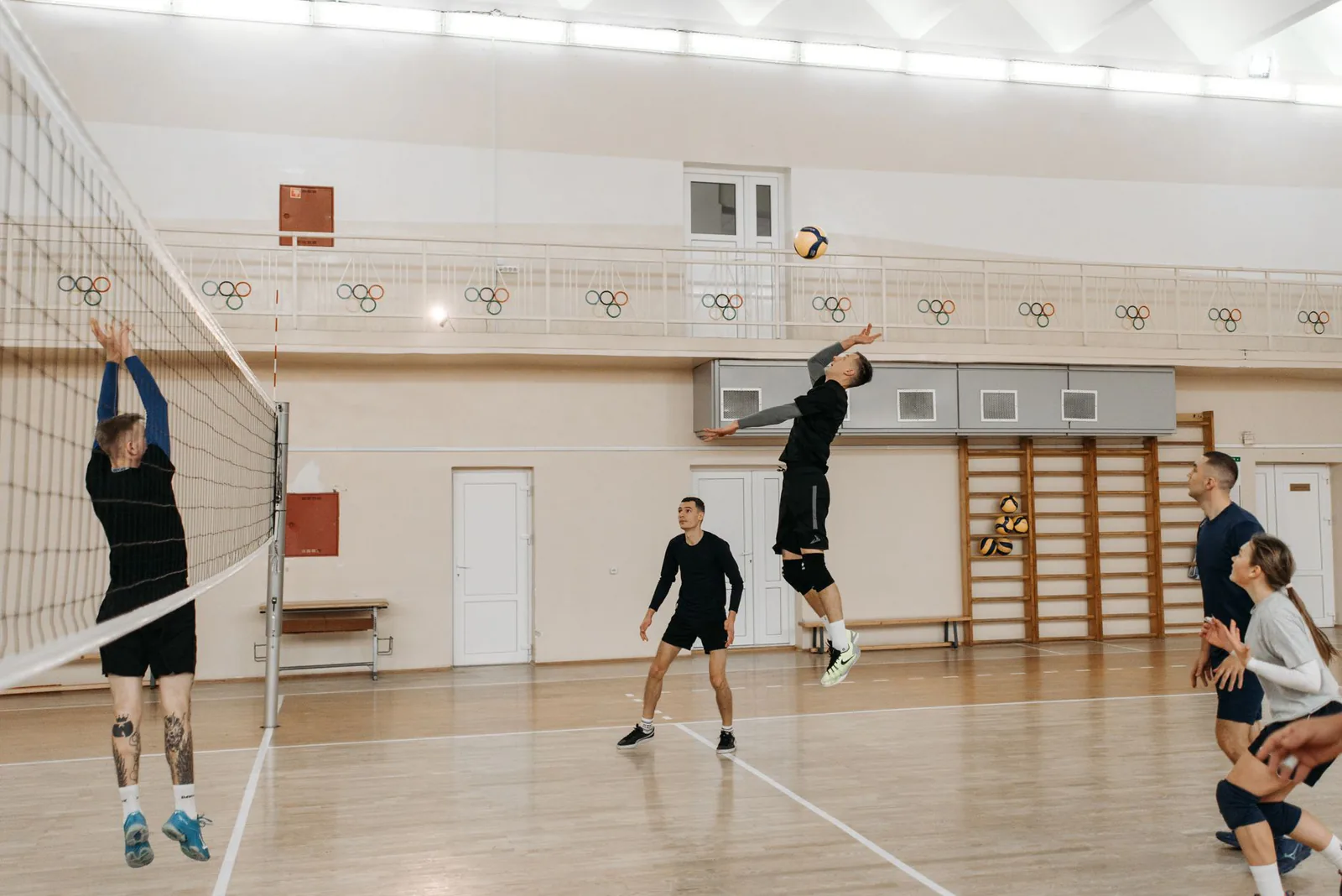 Player spiking the ball during an indoor volleyball match