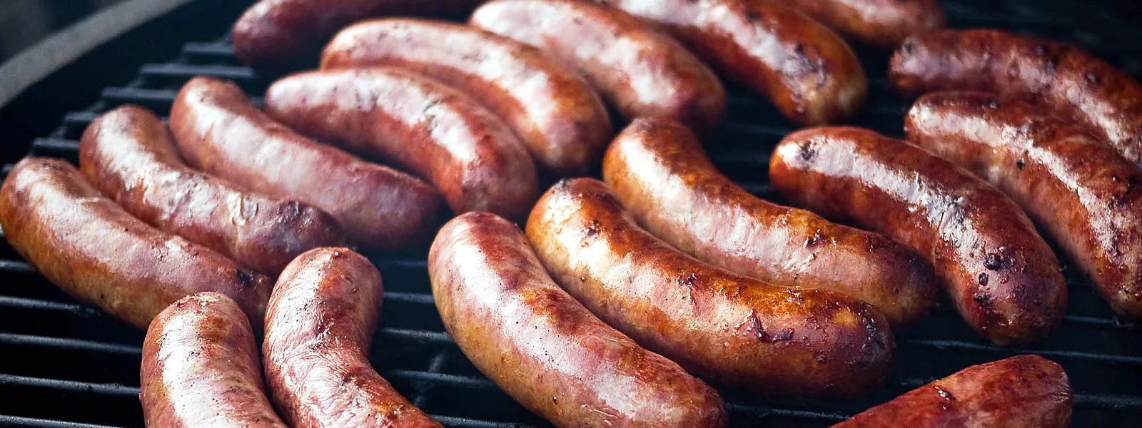 Grilled brats fresh off the grill