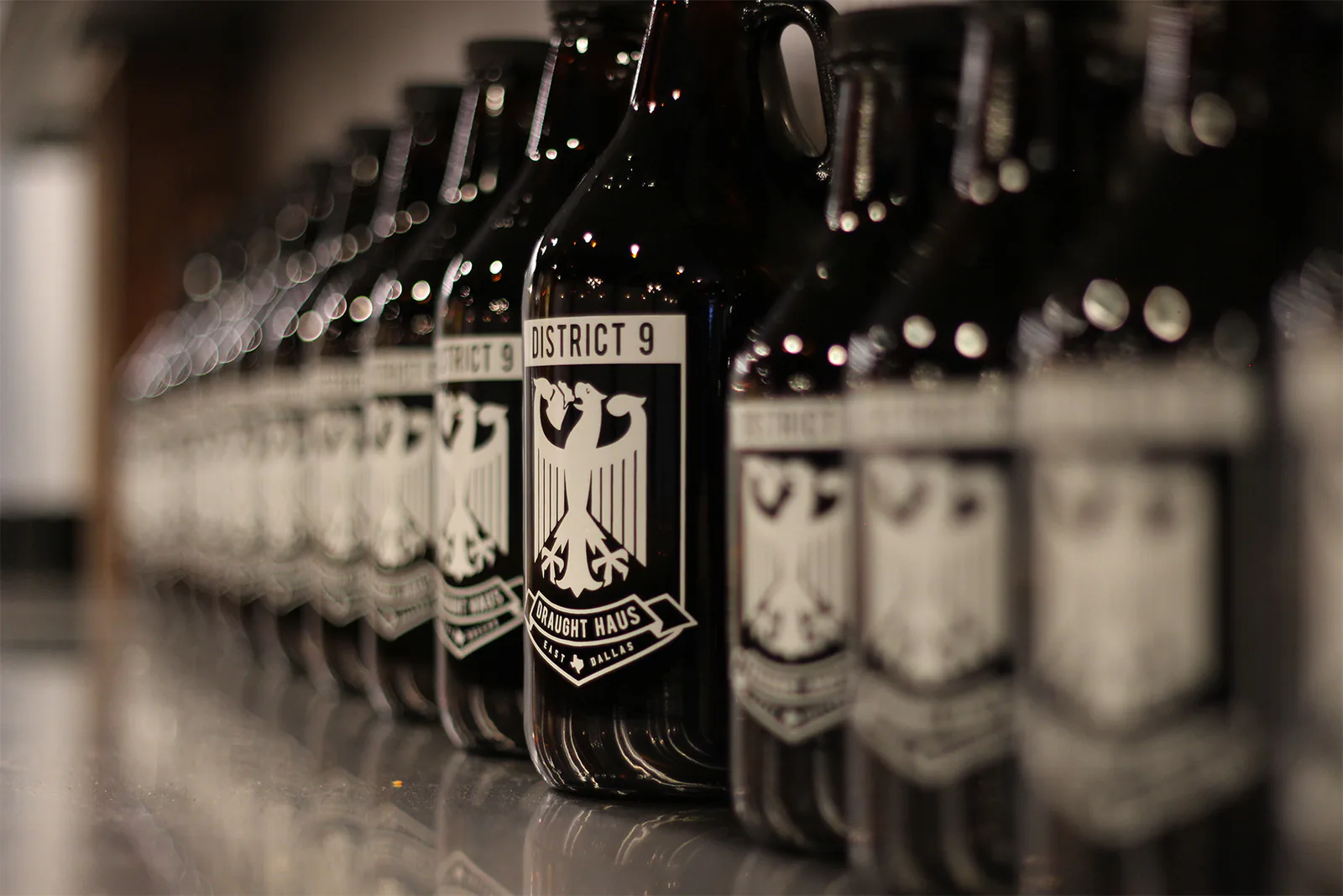 Rows of growlers ready to be filled at District 9 Draught Haus