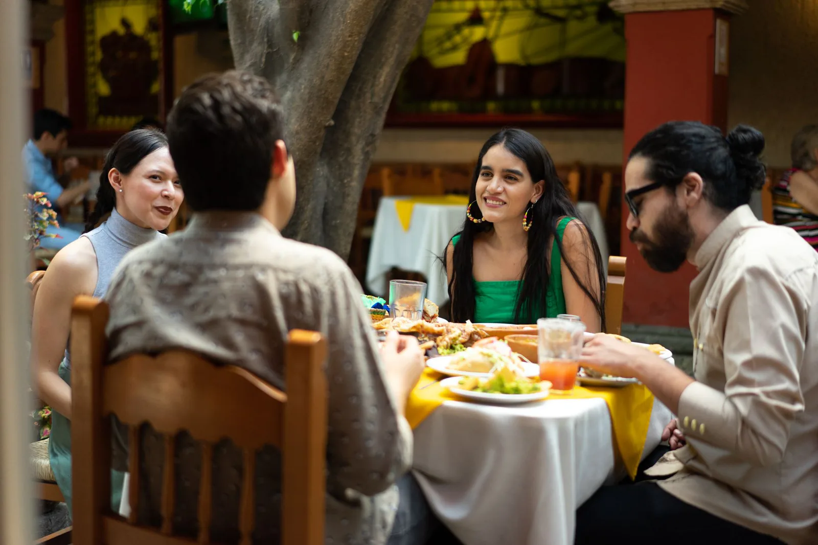 Friends gathered around the table at Dos Amigos