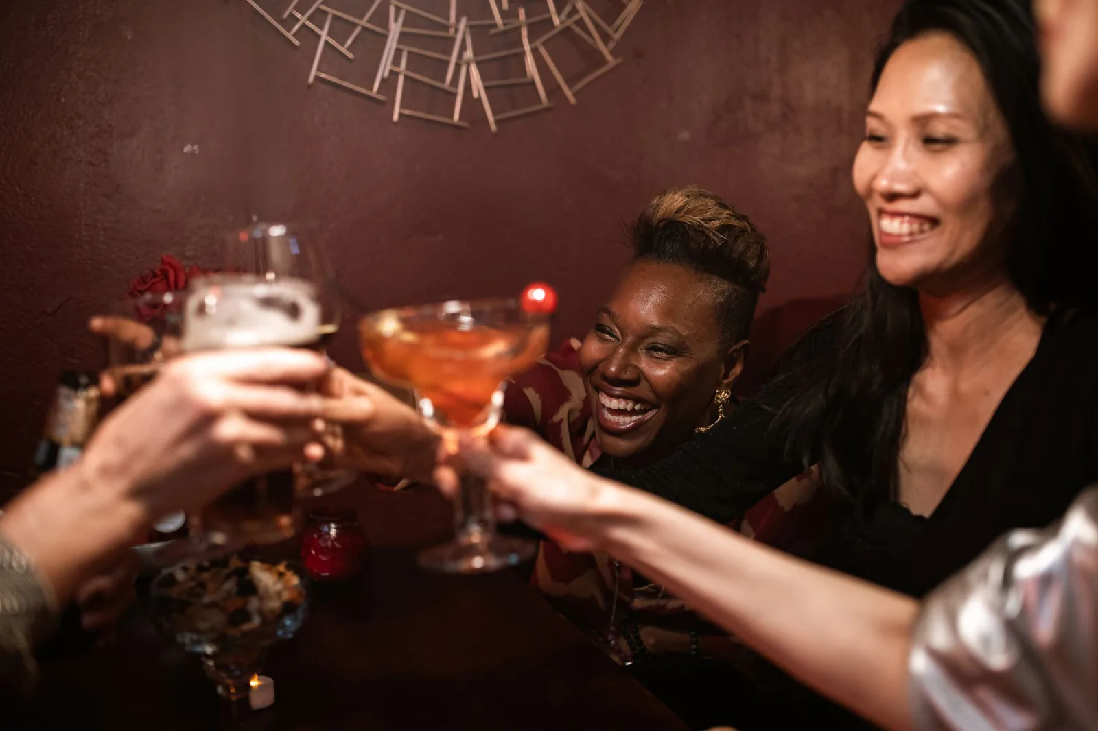 Friends toasting with drinks