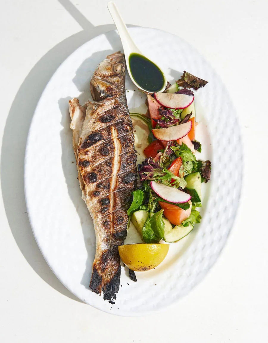 Whole grilled branzino with lemon and herbs