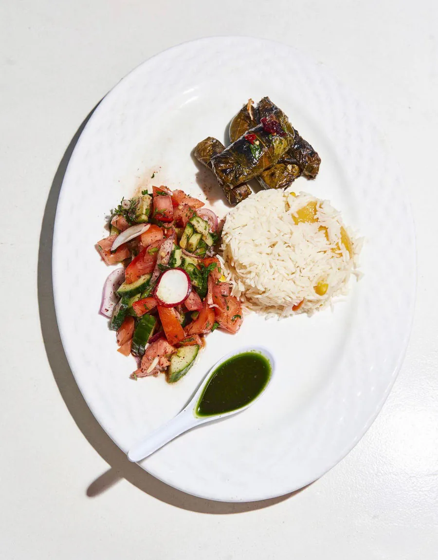 Grilled salmon dolmade in grape leaves