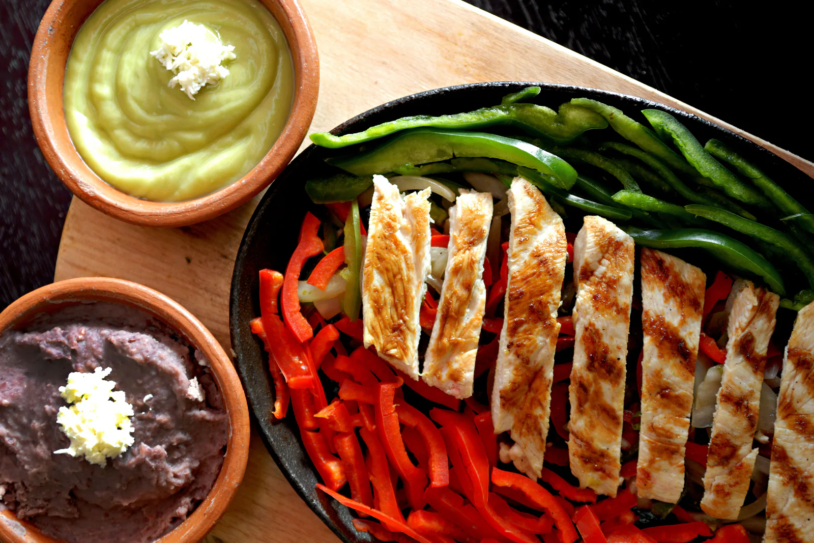 Sizzling chicken fajitas with peppers and all the fixings