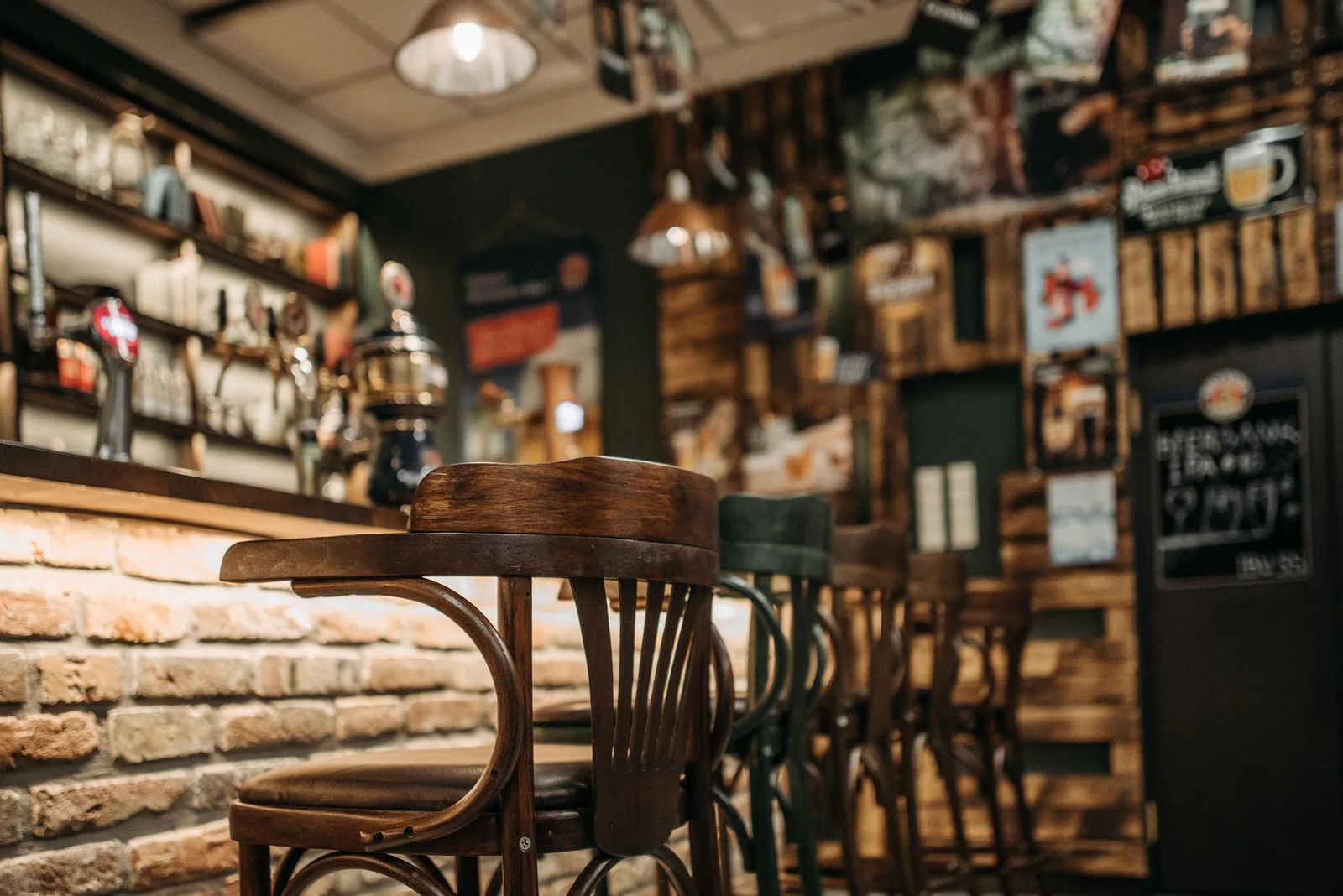 The warm wooden interior of the Eno's Pizza Tavern dining room