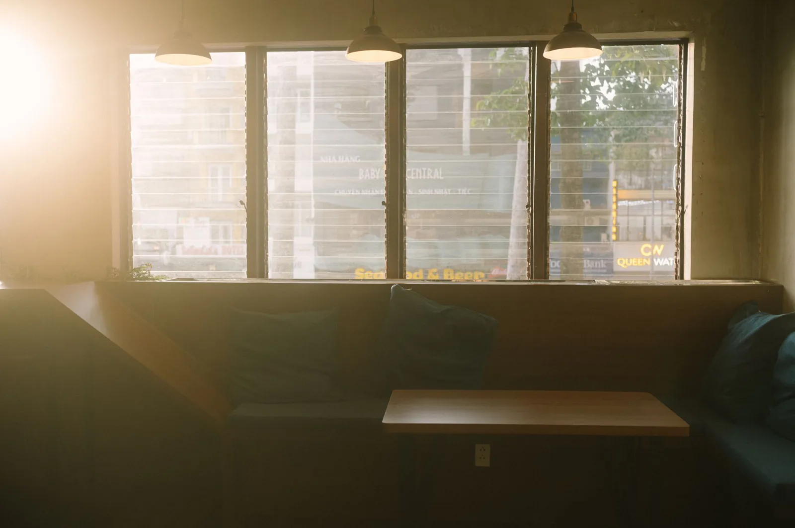 Sunlit dining room with wooden tables
