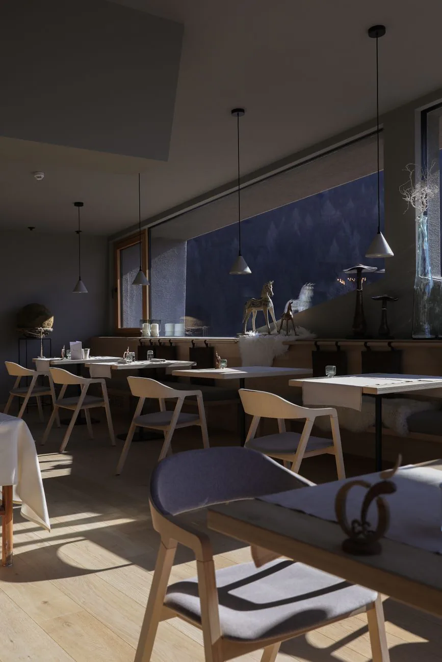 Cafe interior with warm wooden tables and chairs