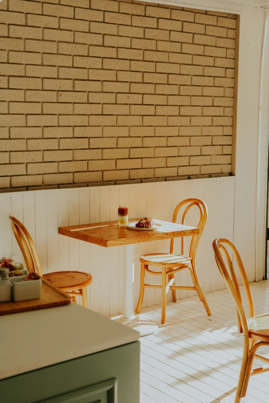 Wooden chairs and brick wall in the dining room