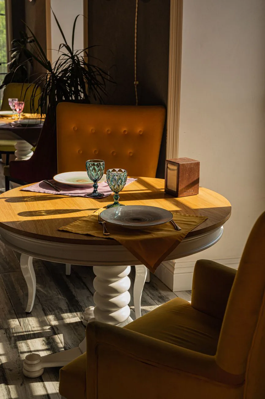 Warmly lit table set for dinner at the cafe