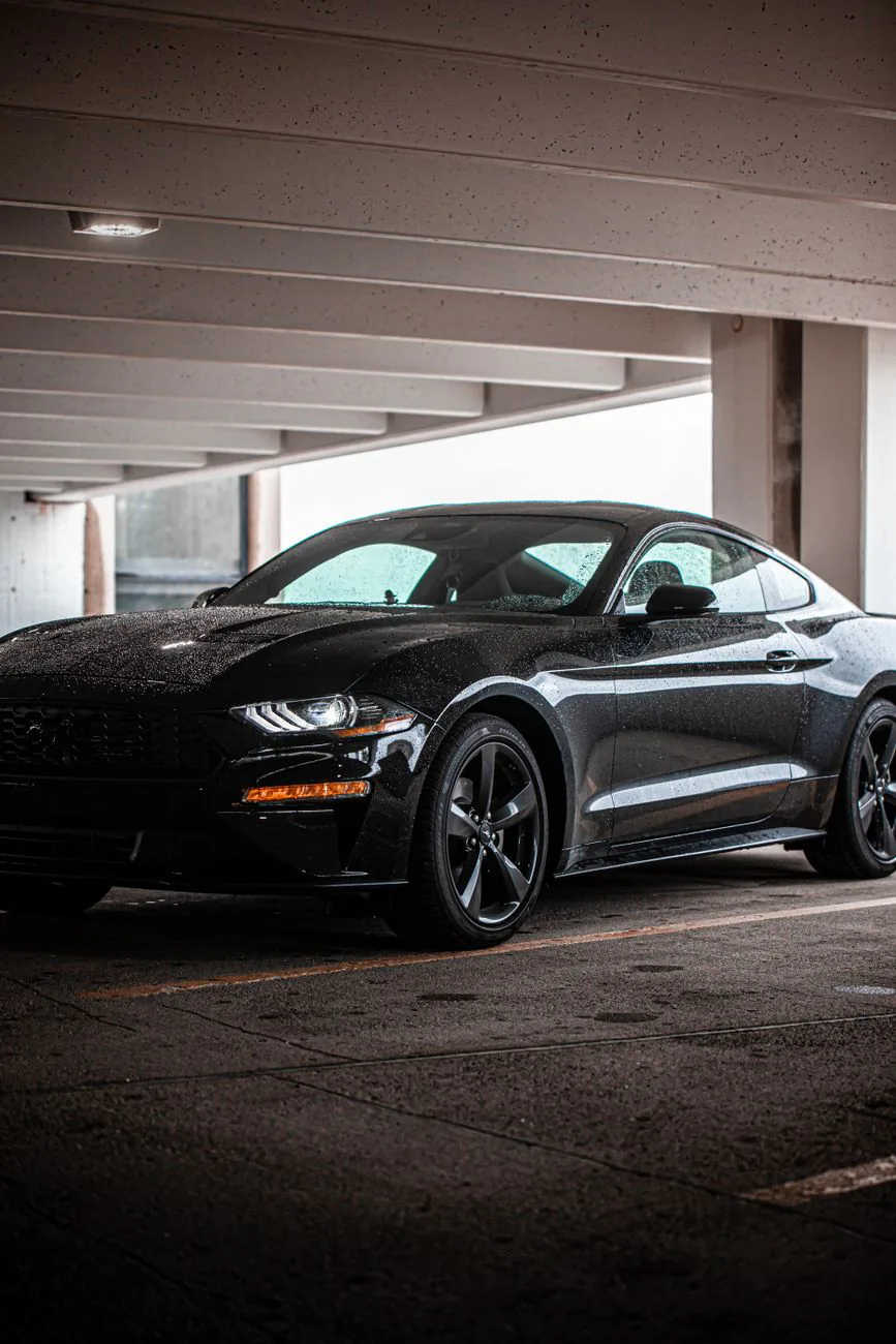 Black car in a dimly lit garage