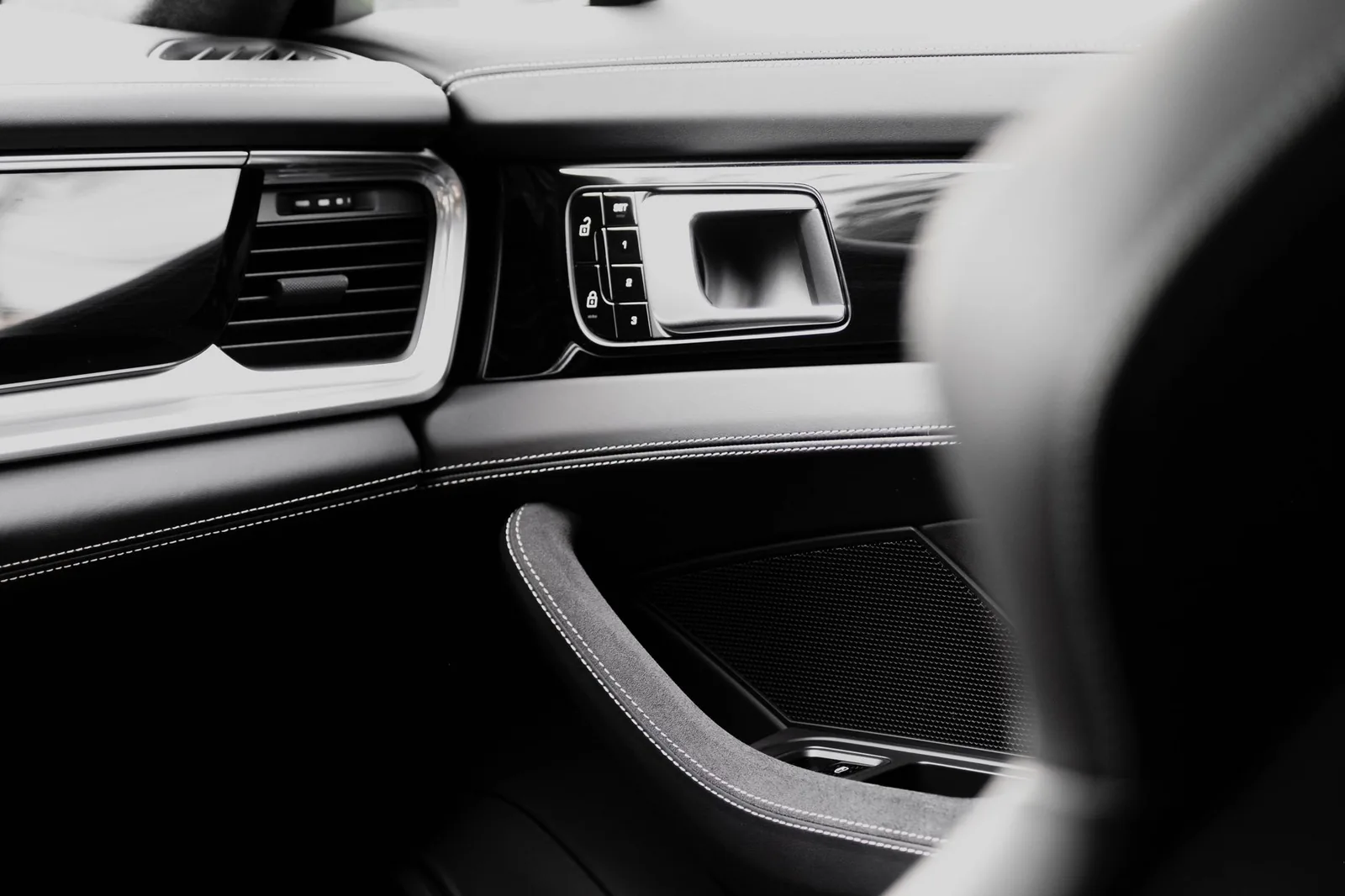 Luxury car dashboard with leather stitching detail