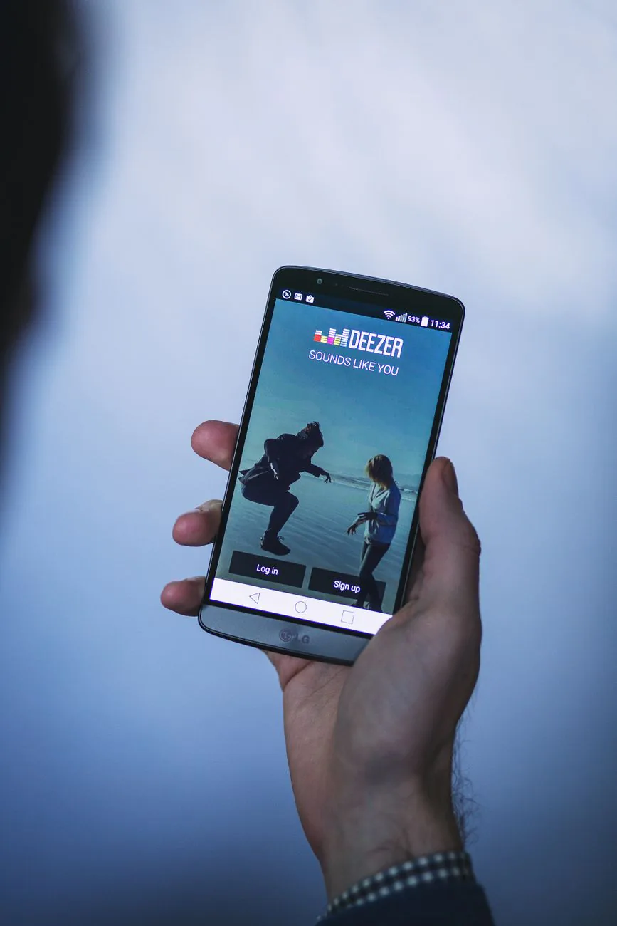 Custom mobile app login screen held in hand