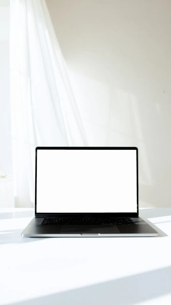 Minimalist laptop showing a freshly built website screen