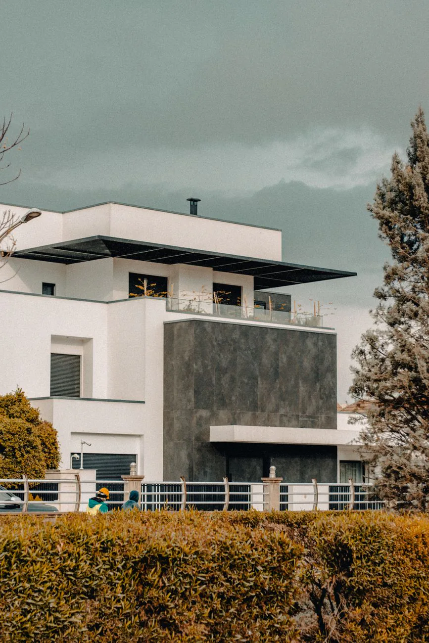 Summit Roofing website shown on the facade of a modern house with geometric roofline
