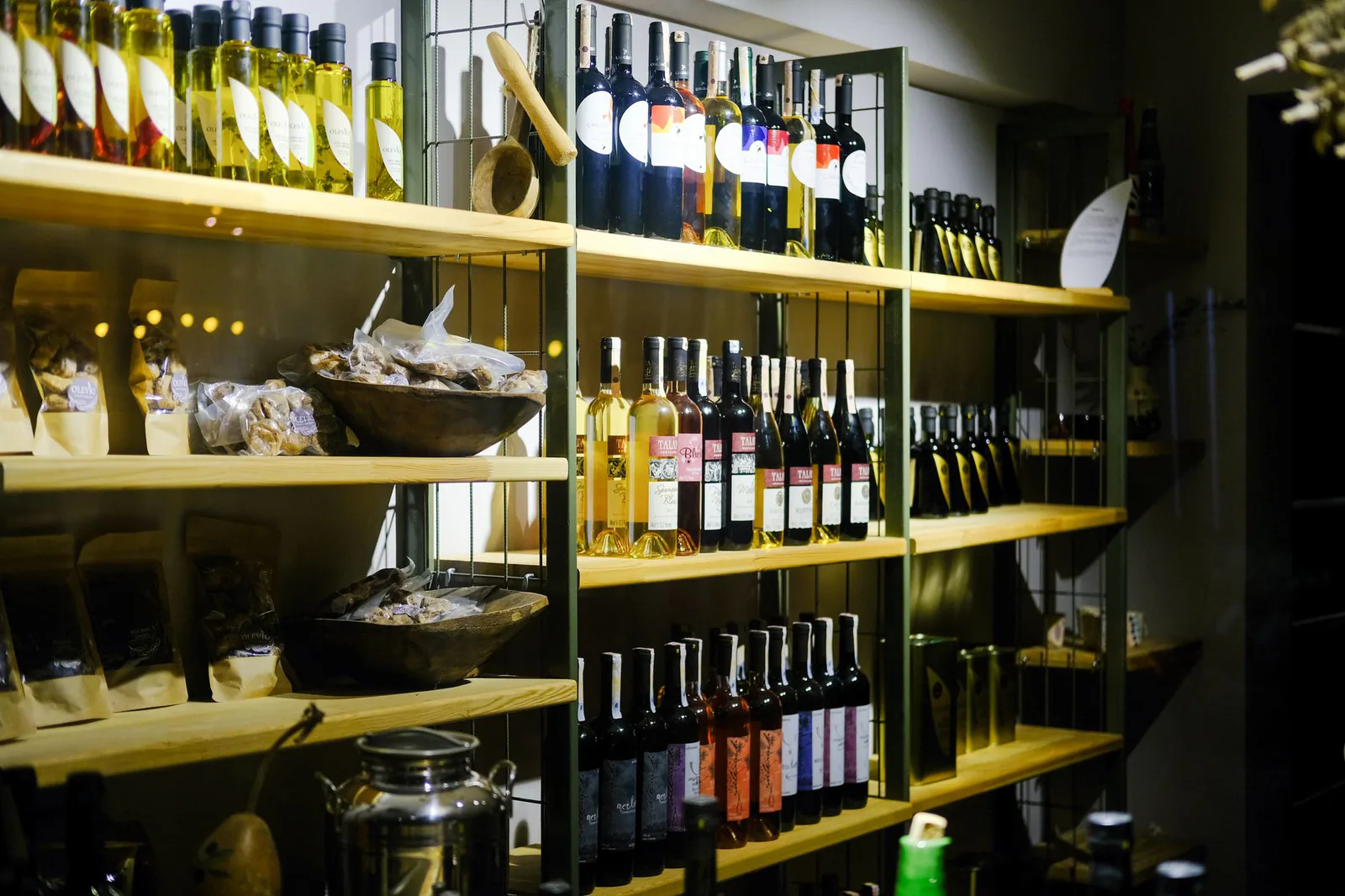 Wooden shelves lined with carefully chosen wine bottles