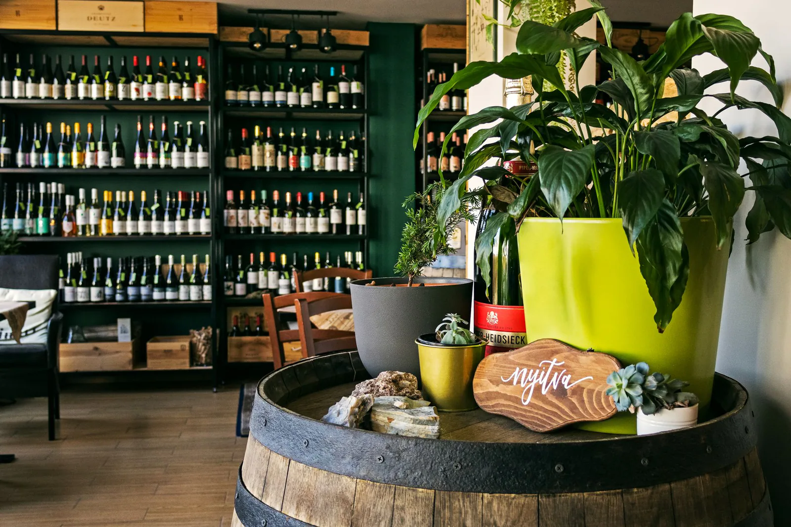 A warm, inviting wine bar lined with bottles