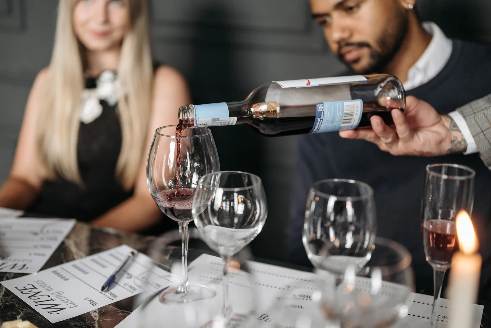 Wine being poured at the shop during a gathering