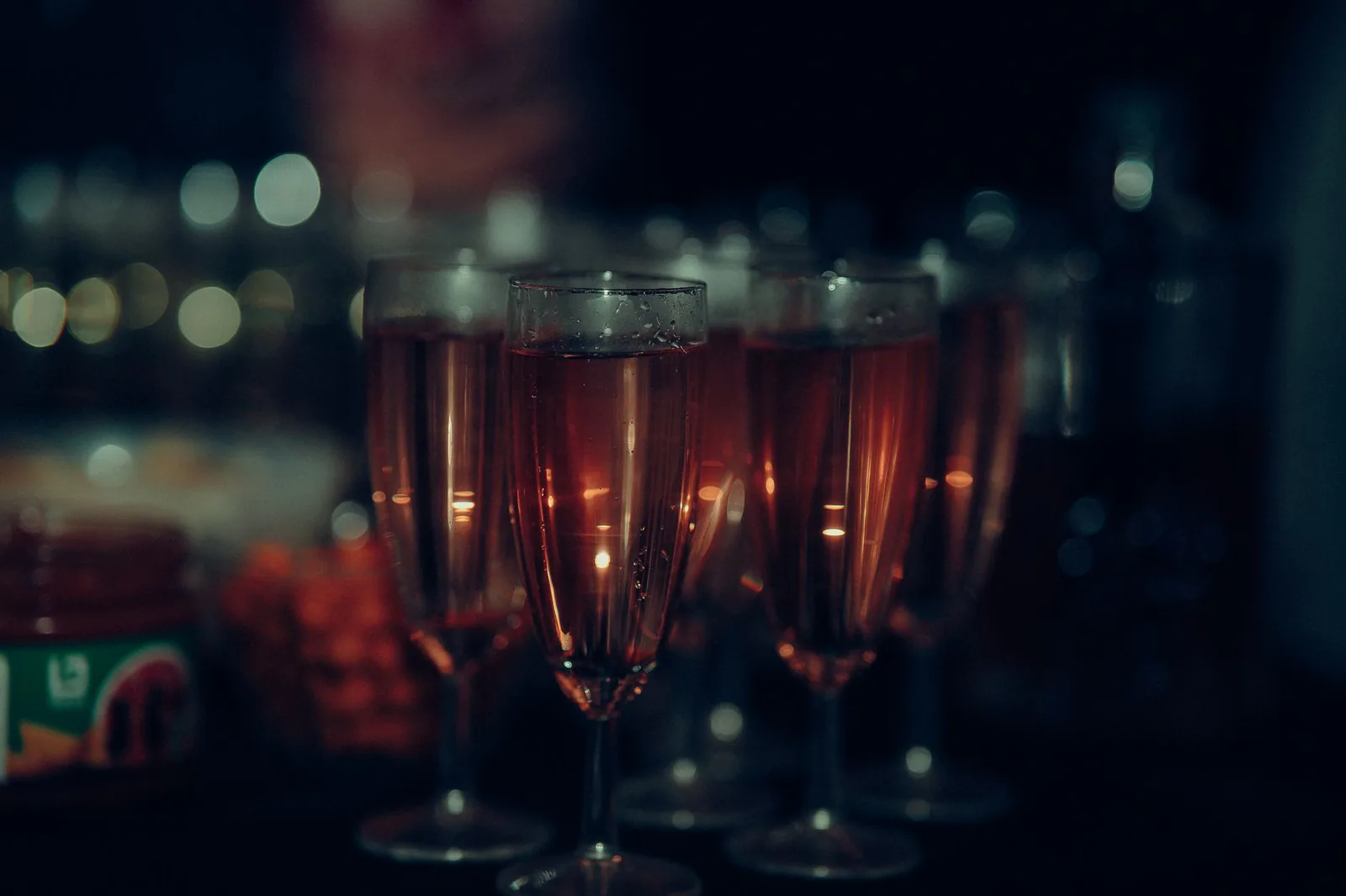Champagne glasses glowing at a festive evening gathering