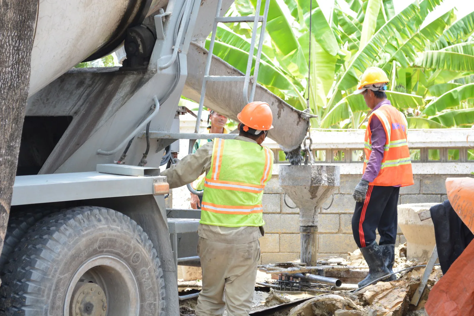 Crew replacing an old driveway with fresh poured concrete