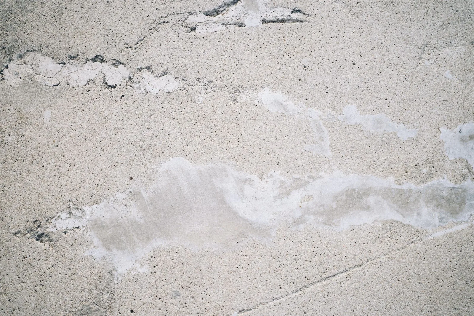 Worn, cracked concrete surface before replacement