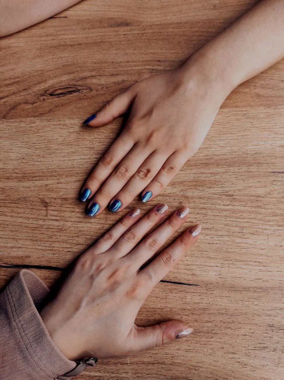 Two sets of nails with colorful designs