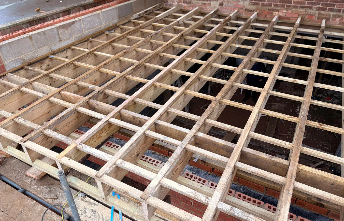 Roofers preparing a roof with new treated battens and breathable membrane