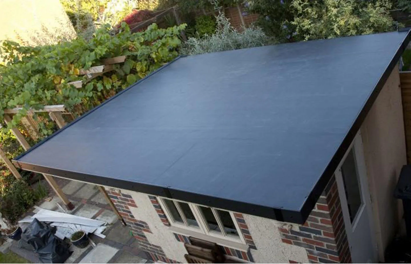New flat roof replacement with durable rubber membrane