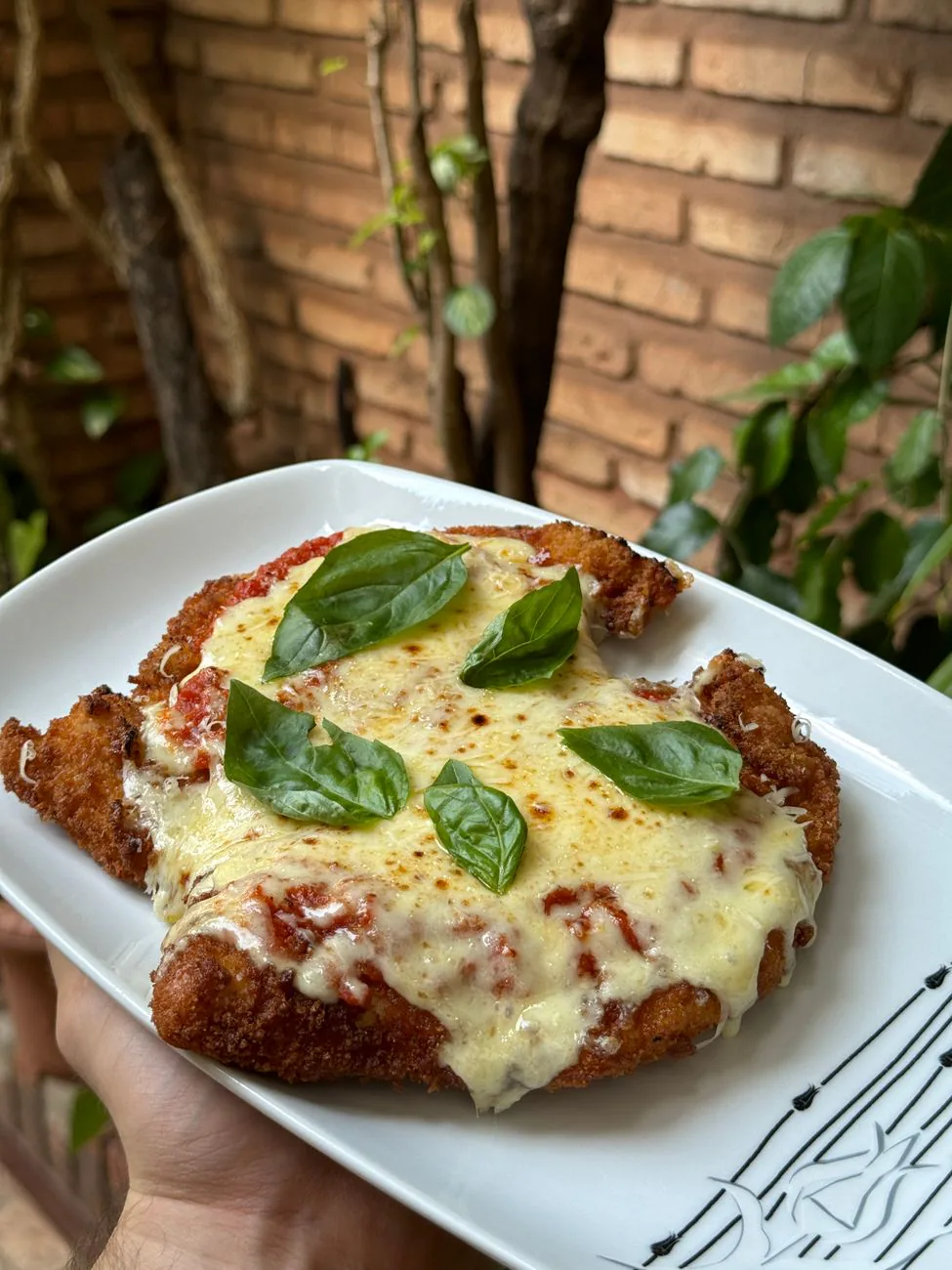 Crispy chicken cutlets with fresh basil