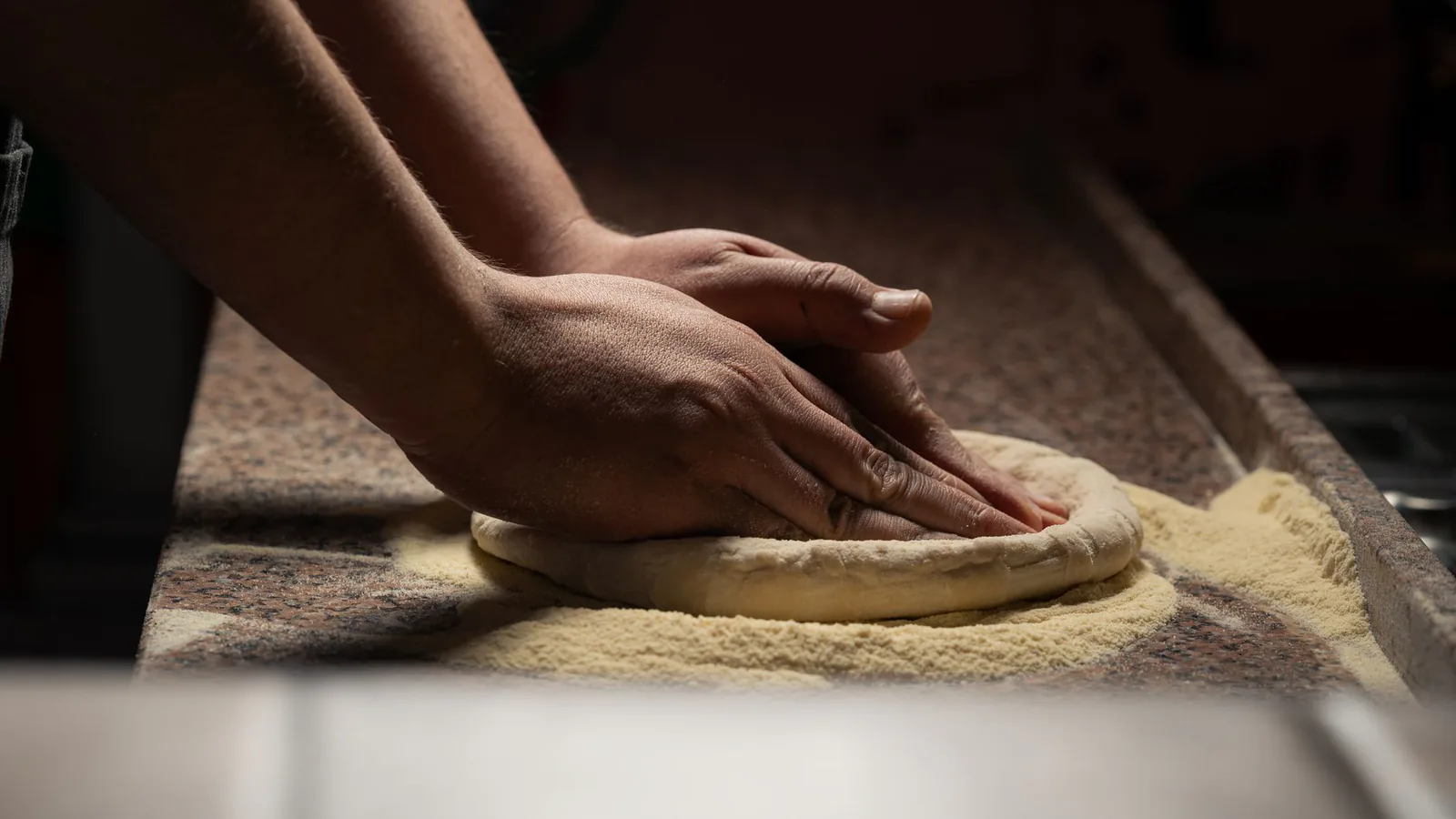 Dough being worked by hand