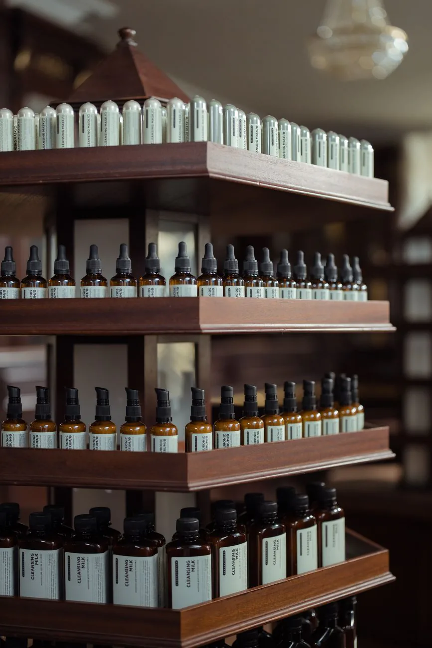 Amber bottles and remedies on a rustic apothecary shelf