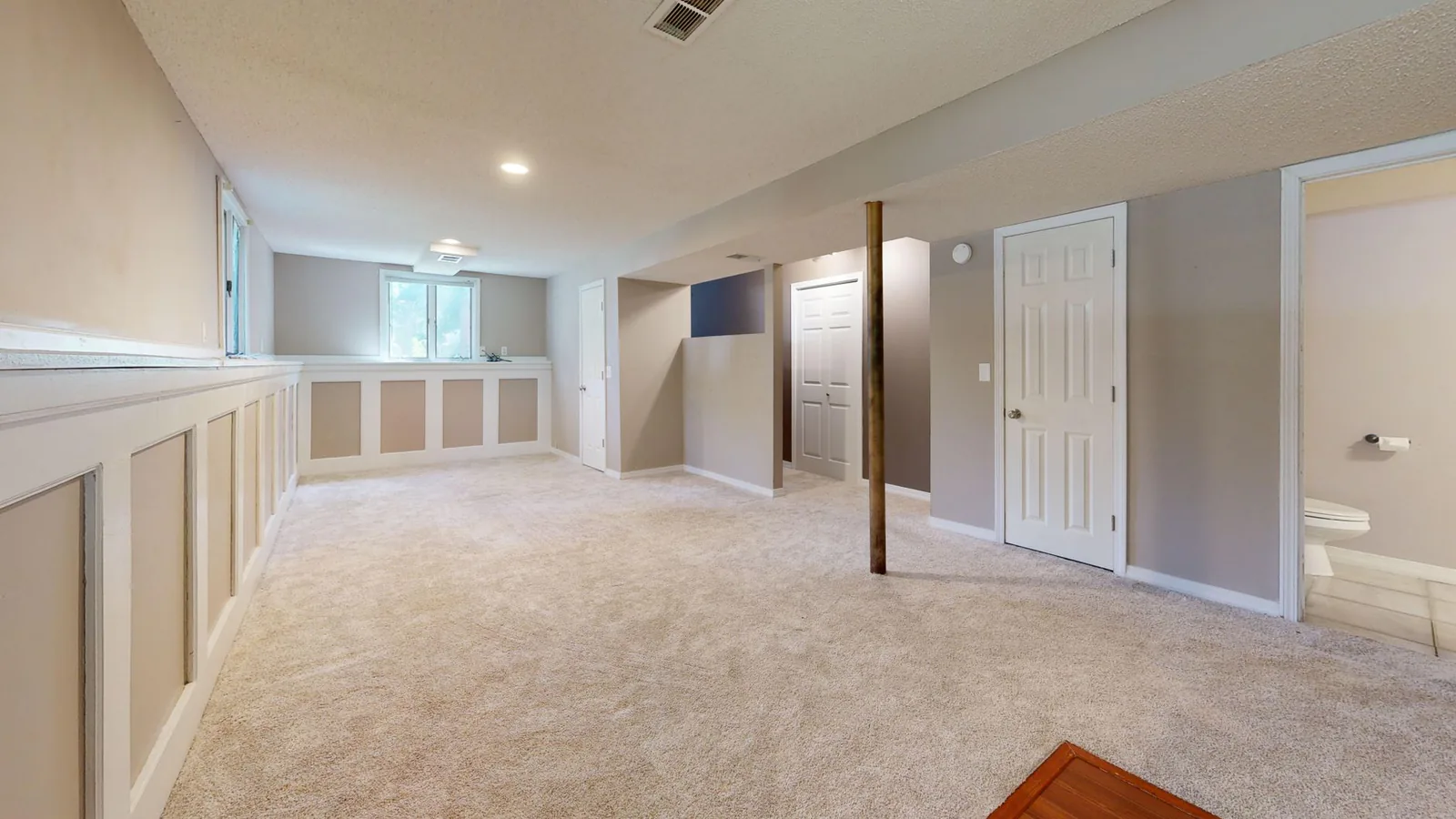 Completed bright basement family room renovation