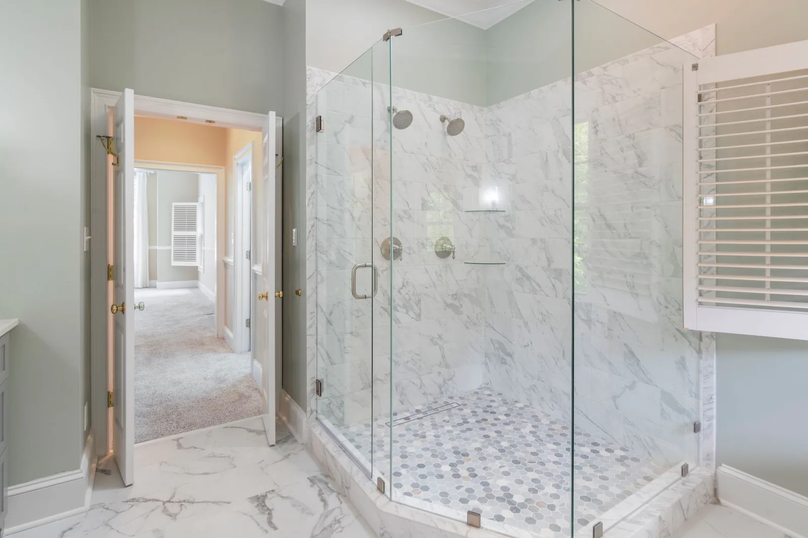 Completed luxury bathroom renovation with glass shower