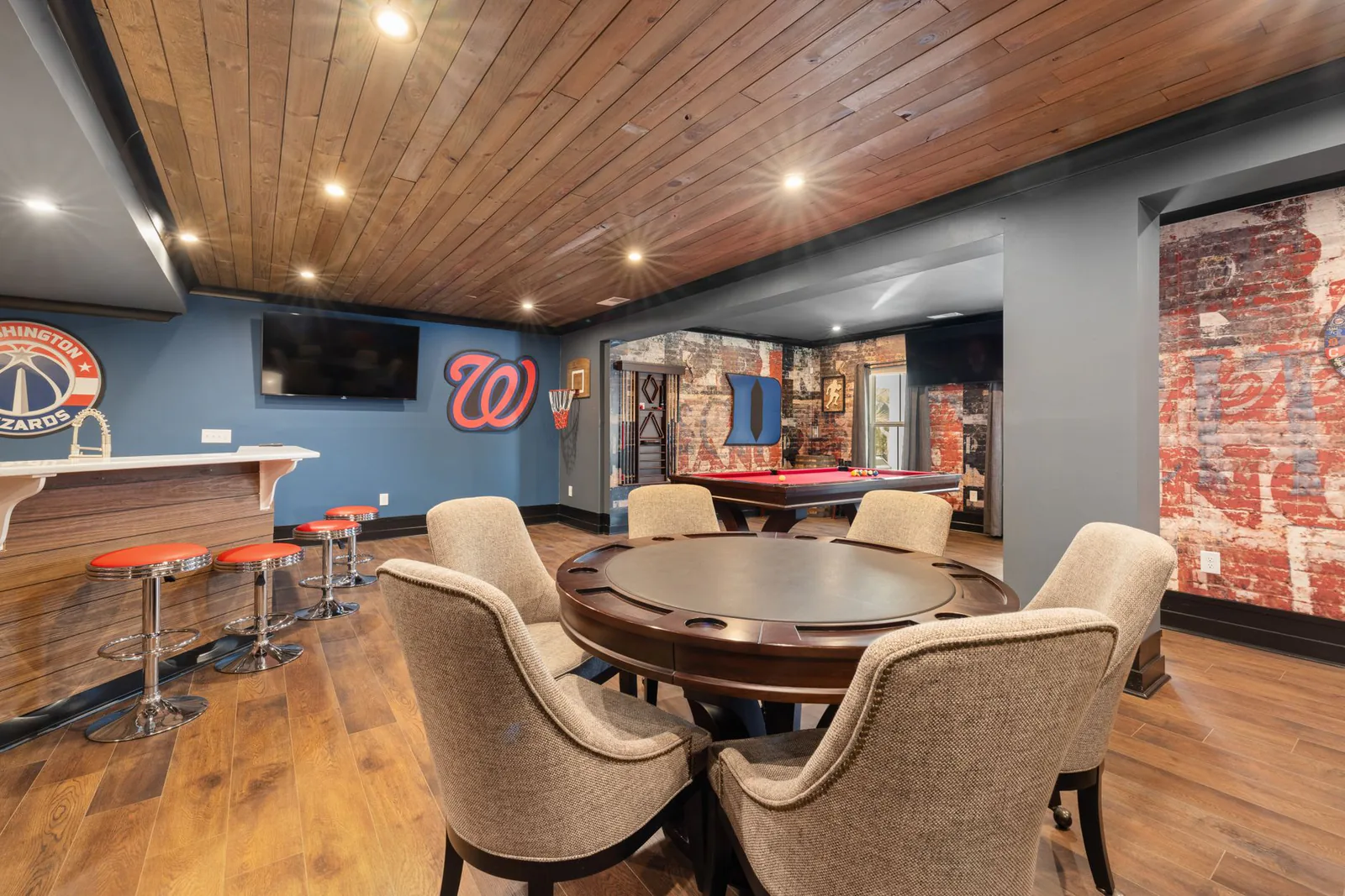 Finished basement game room with bar and seating