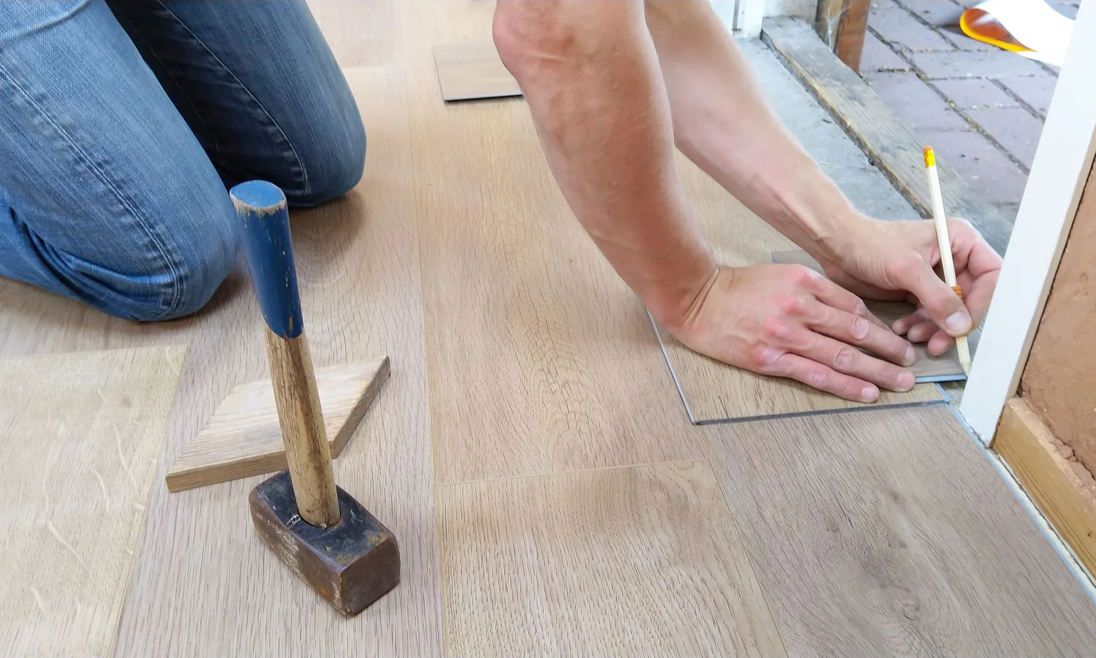 Craftsman installing hardwood flooring