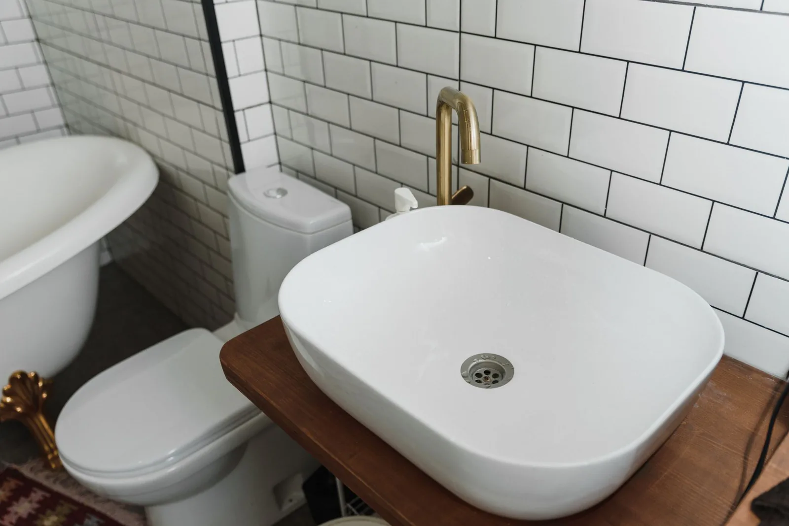 Clean bathroom with ceramic sink and fixtures ready for repair