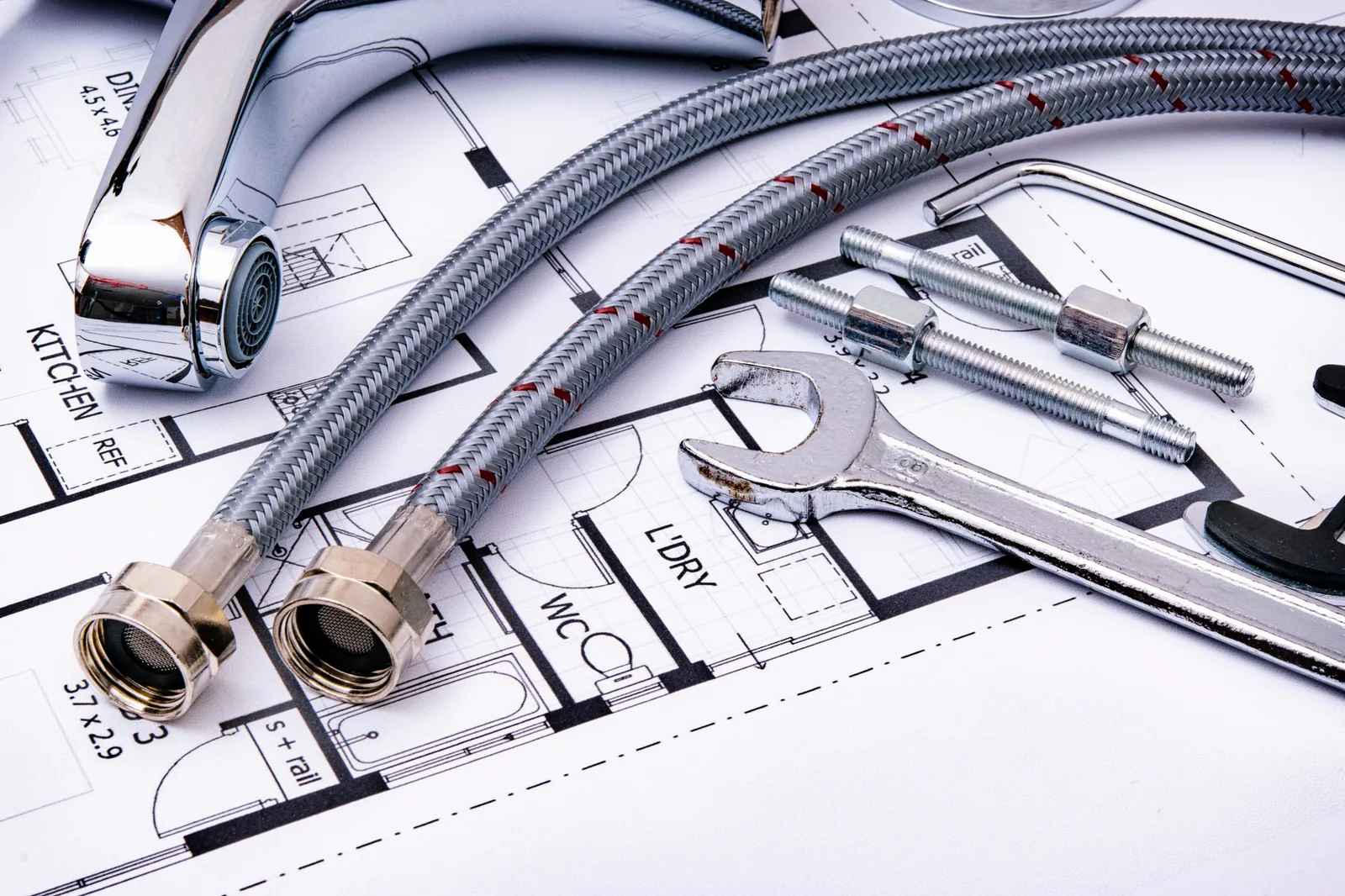 Kitchen faucet and plumbing tools ready for installation