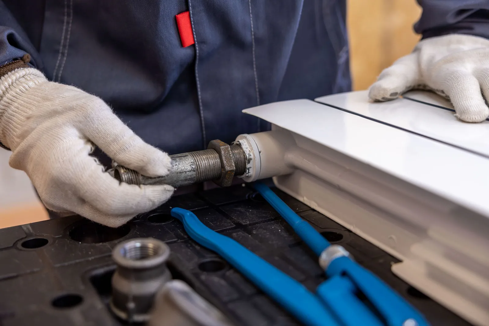 Plumber using specialized tools to track down a hidden leak