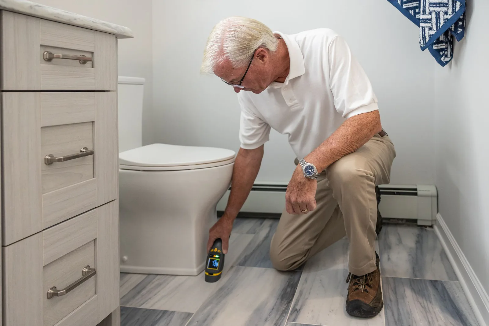 SDL Plumbing technician inspecting fixtures during a home repair call