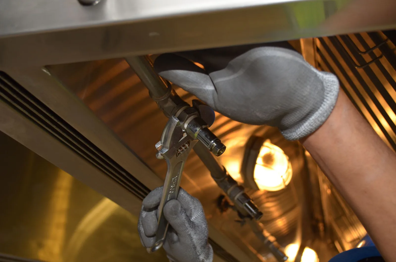 Plumber working on drain and sewer lines with professional tools