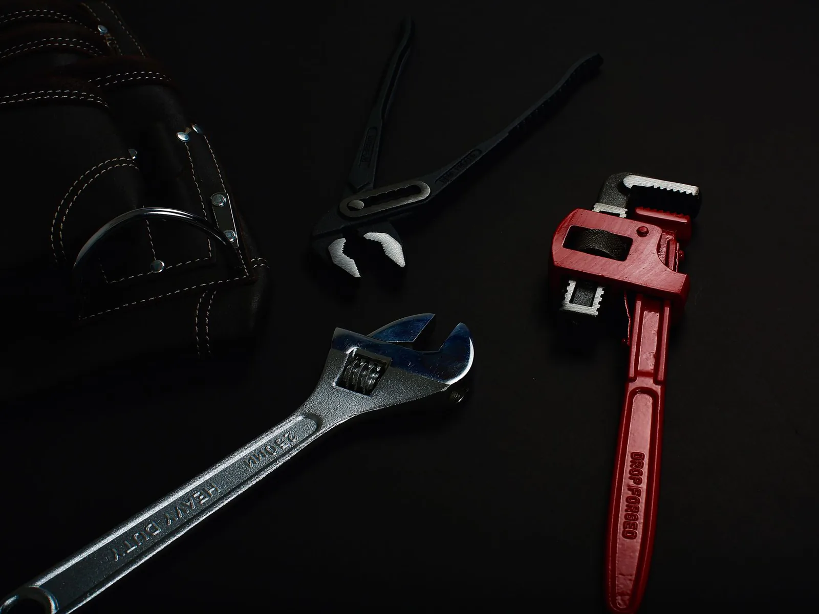 Pipe wrenches and plumbing tools used for pipe repair