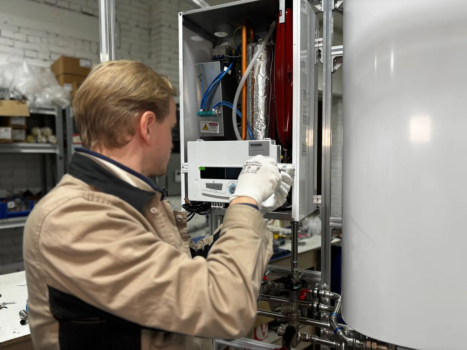 SDL Plumbing technician at work on a home mechanical system