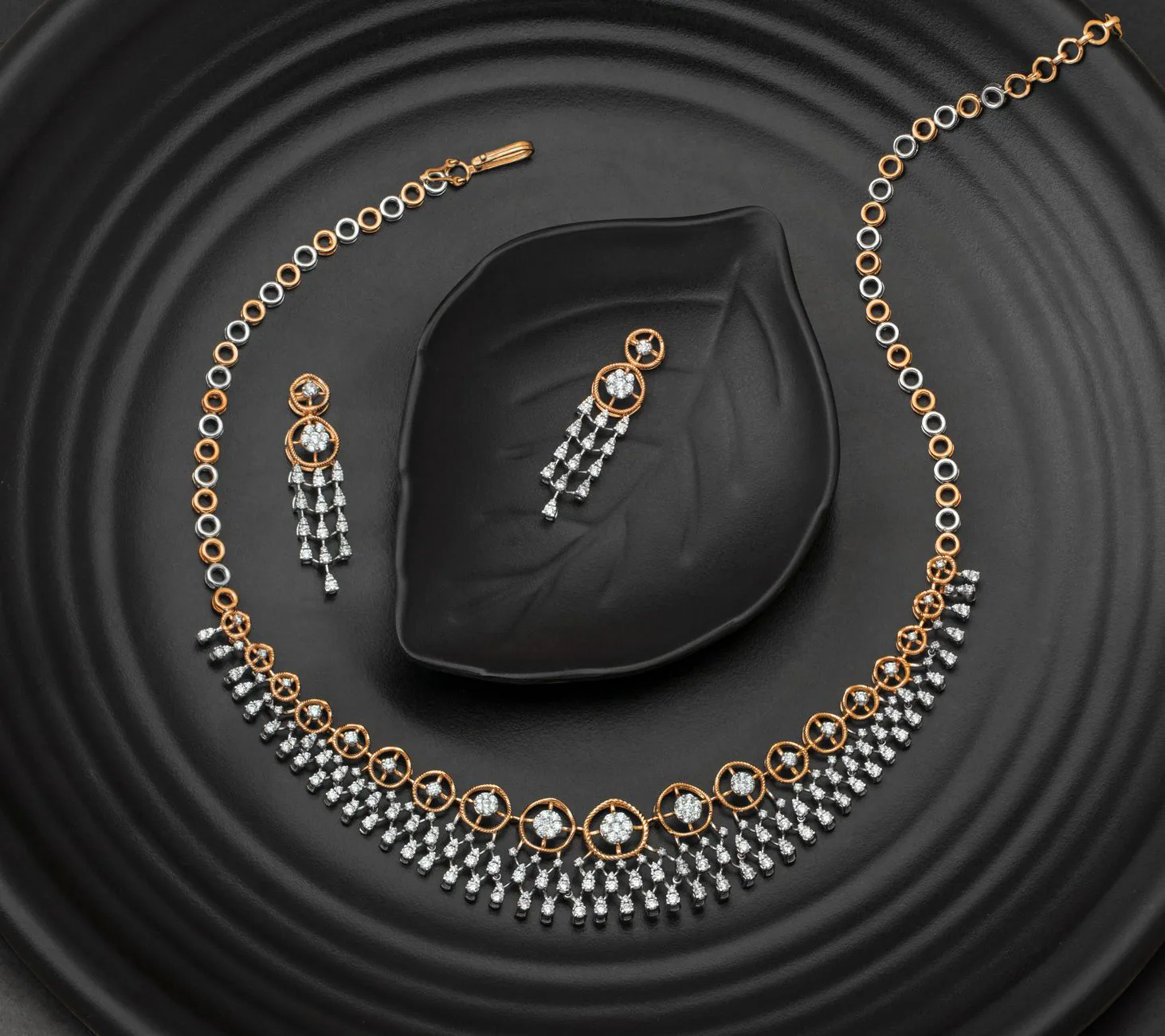 Diamond necklace and earrings set on black