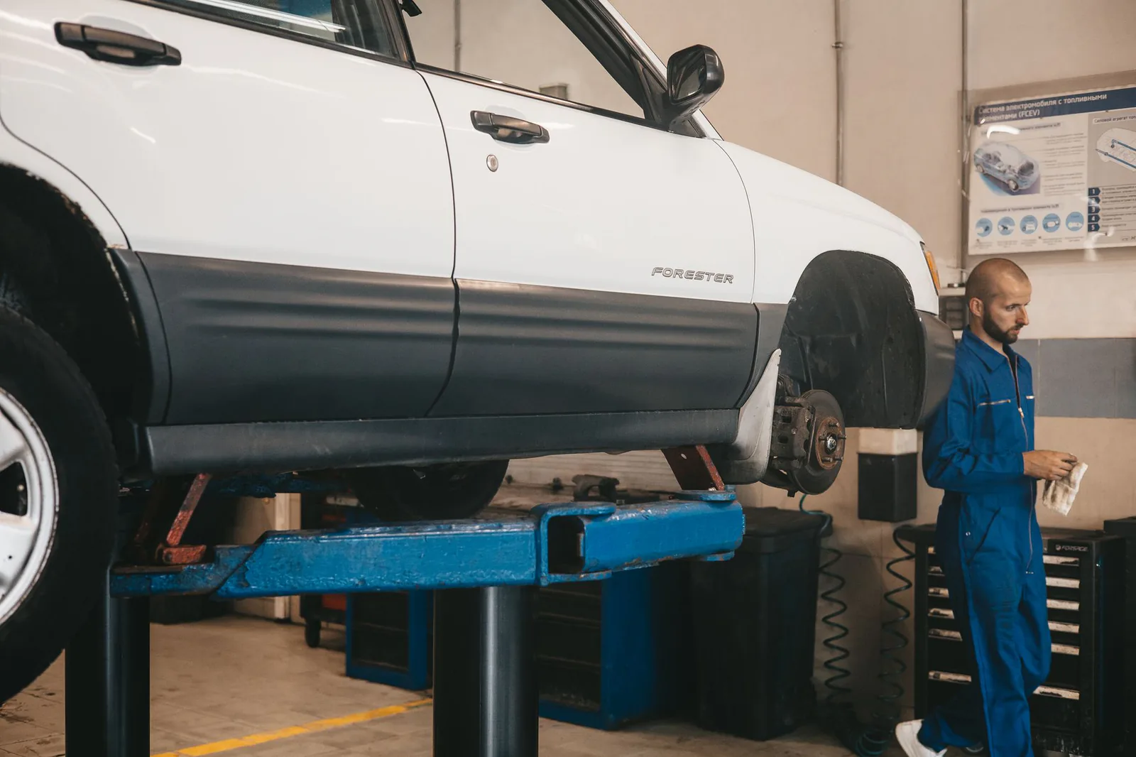 Vehicle raised on a lift during service evaluation